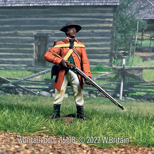 Collectible toy soldier Black militiaman standing in field while holding a musket.