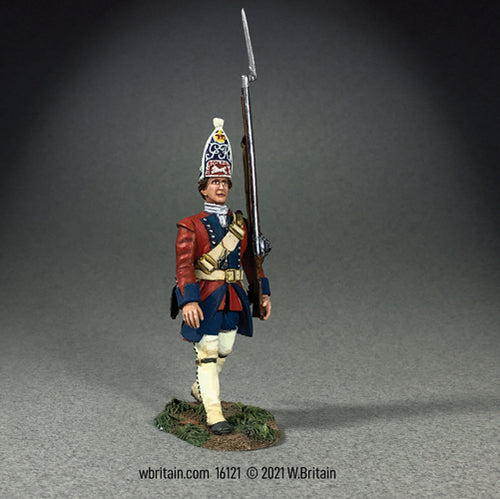 Collectible toy soldier miniature British 60th  Regiment of Foot Marching. Soldier is in red coat while holding a musket and Bayonet.