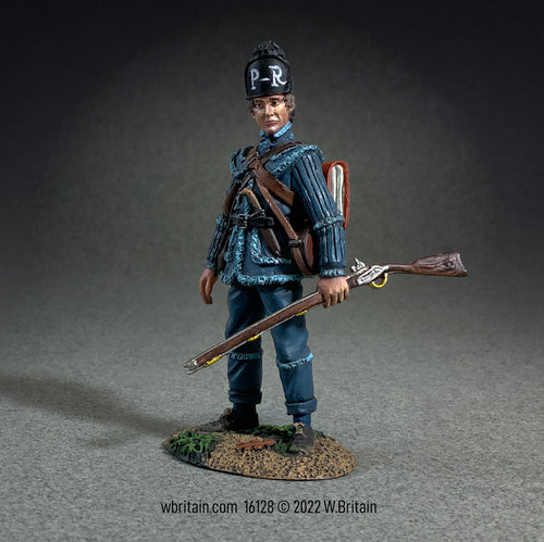Collectible toy soldier in blue uniform and holding a musket.