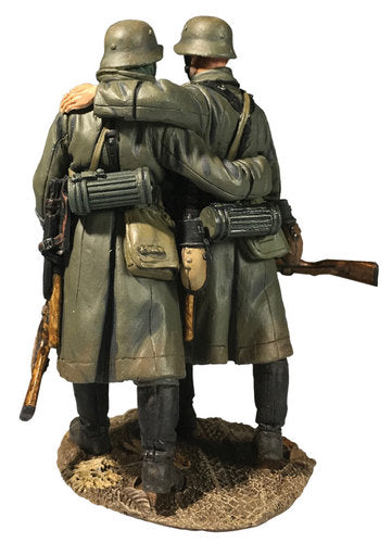 Toy soldier army men set German Helping Wounded Comrade in Greatcoat. Rear view.