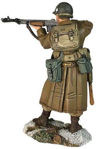 rear view of Toy soldier U.S. 101st Airborne in Greatcoat Standing Firing.