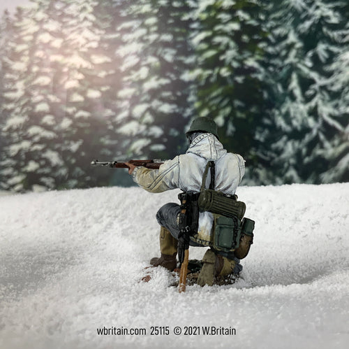 Toy soldier miniature army men German Grenadier Kneeling in White Parka. In the snow.