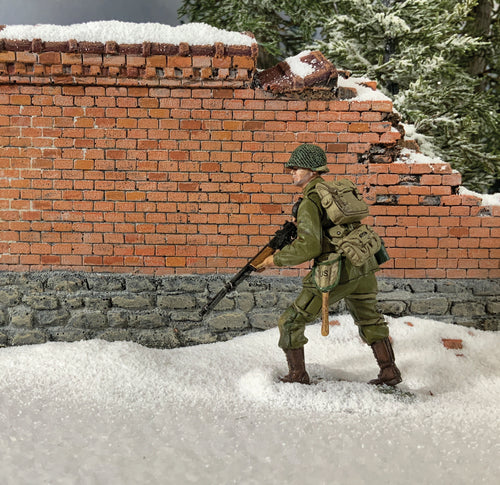 Collectible toy soldier miniature U.S. 101st Airborne Advancing with BAR. He is in the snow.