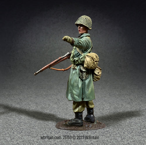 Toy soldier army men U.S. Infantryman in Raincoat Pointing.