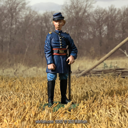 Collectible toy soldier miniature Captain George Armstrong Custer. Standing in a field.
