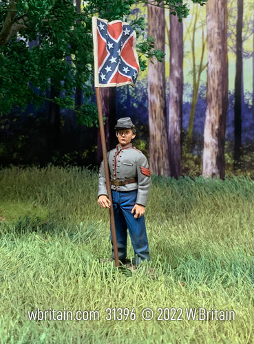 Collectible toy soldier miniature Confederate Artillery Guidon. He is in the woods.