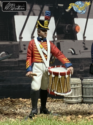 Collectible toy soldier miniature U.S. Marine Drummer 1811 - 18. He is seen at the docks.