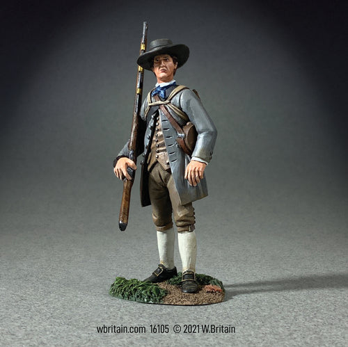 Collectible toy soldier American Militiaman in olive uniform holding a musket.
