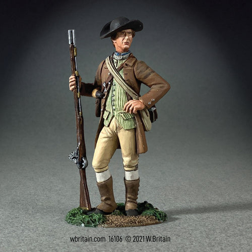 Collectible toy soldier miniature American Militiaman in brown clothing holding a musket.