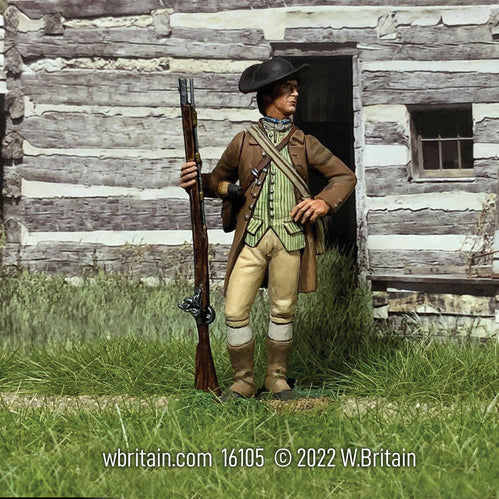 Collectible toy soldier miniature American Militiaman standing with musket in a field. 