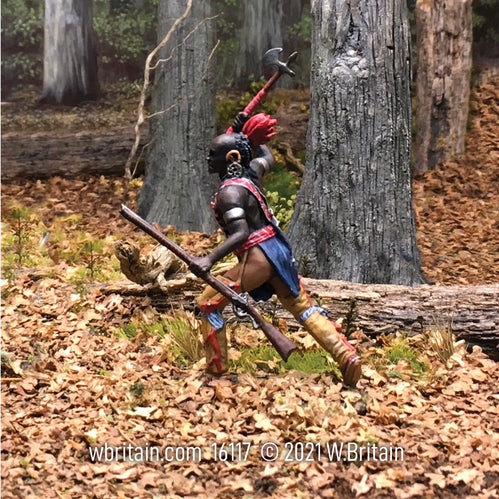 Collectible toy soldier miniature Native Attacking with Trade Axe. He is in the forest.